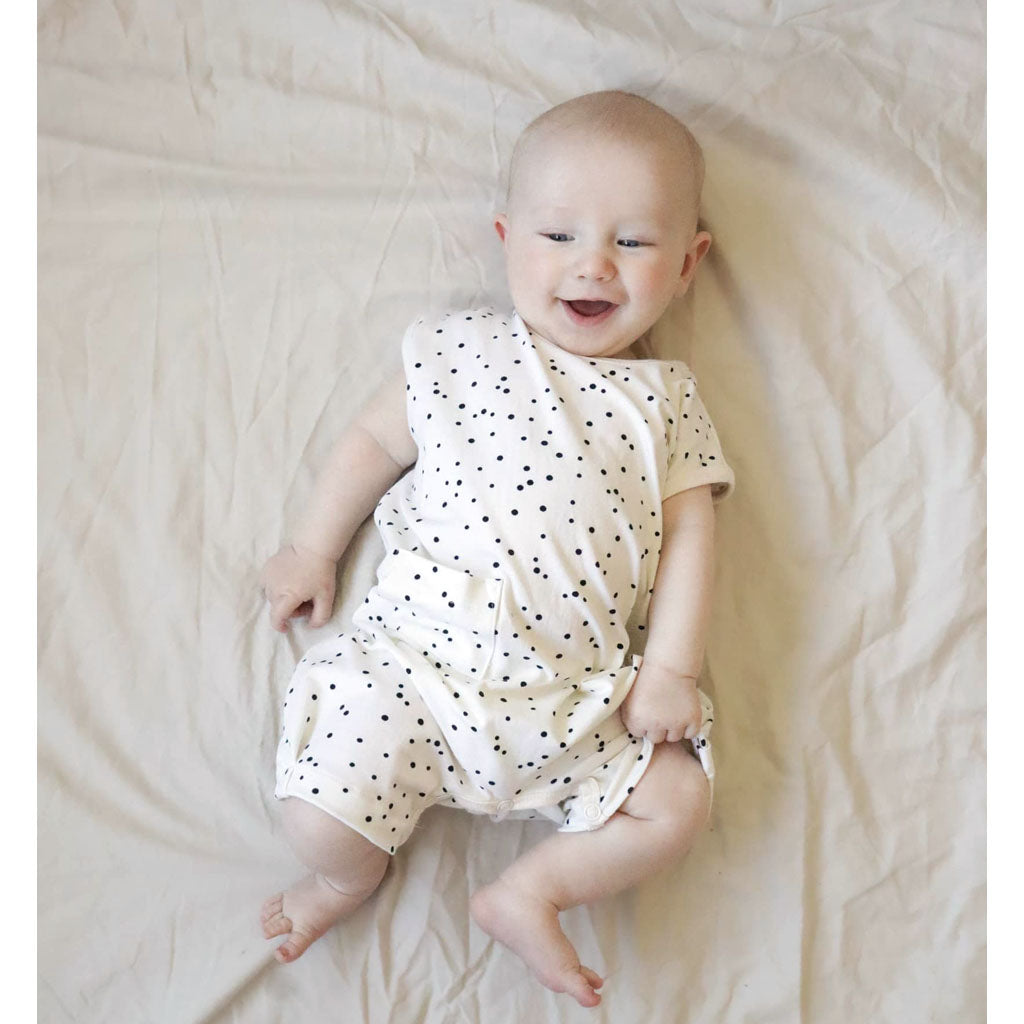 baby wearing black and white playsuit